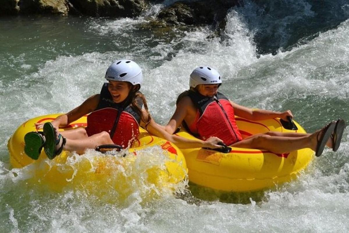 two people in a raft on a river