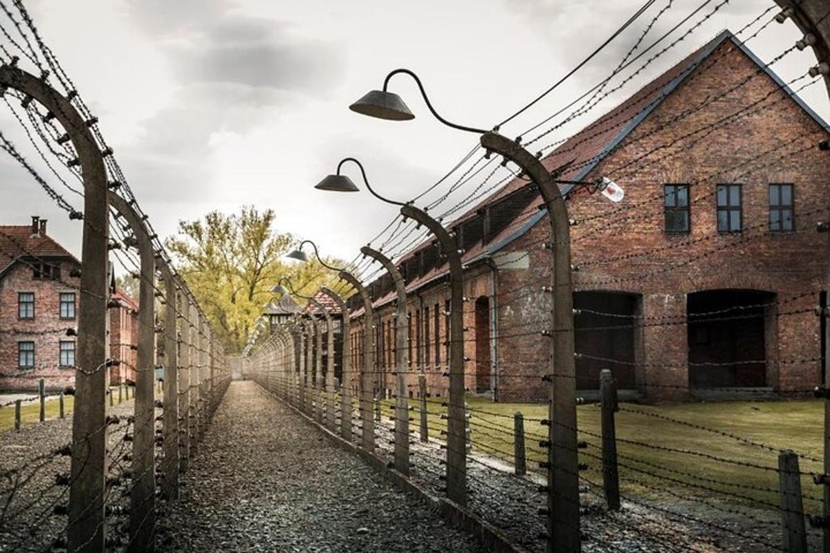 an old building with a fence and street lights