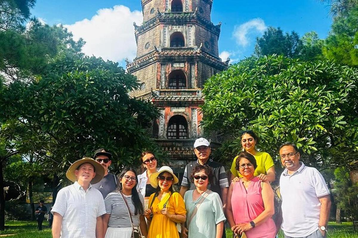 a group of people standing in front of a tower