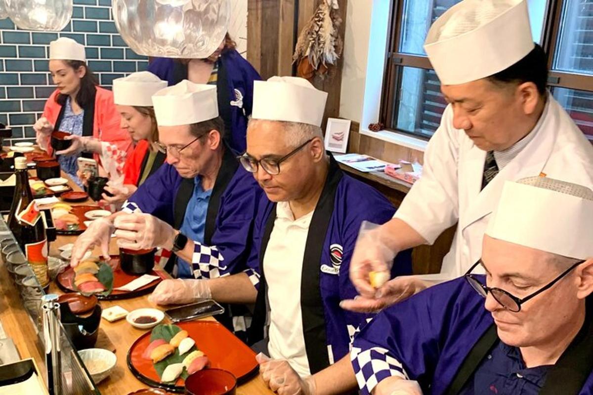 a group of chefs preparing food in a kitchen