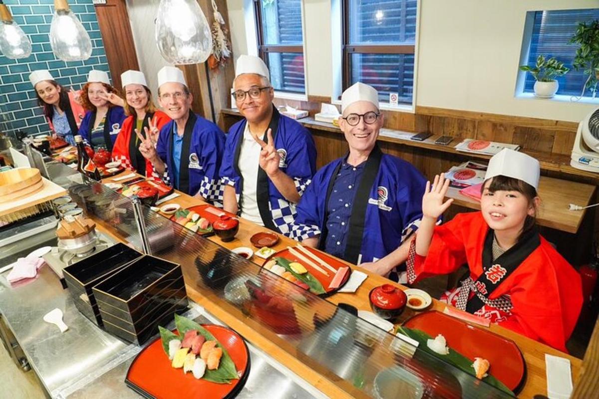 a group of chefs posing for a picture in a kitchen