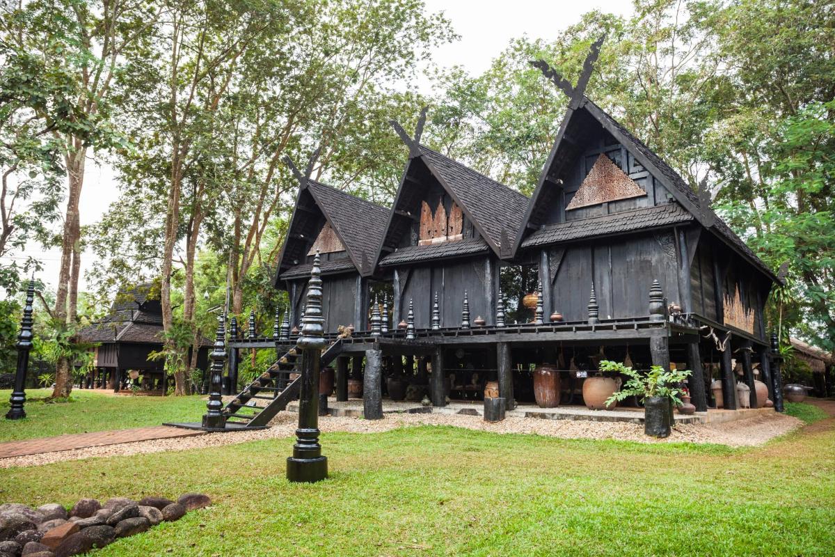 a house with a play structure in the yard