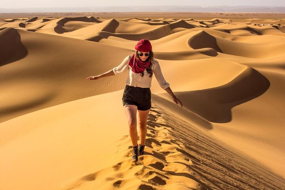 a woman walking through the desert