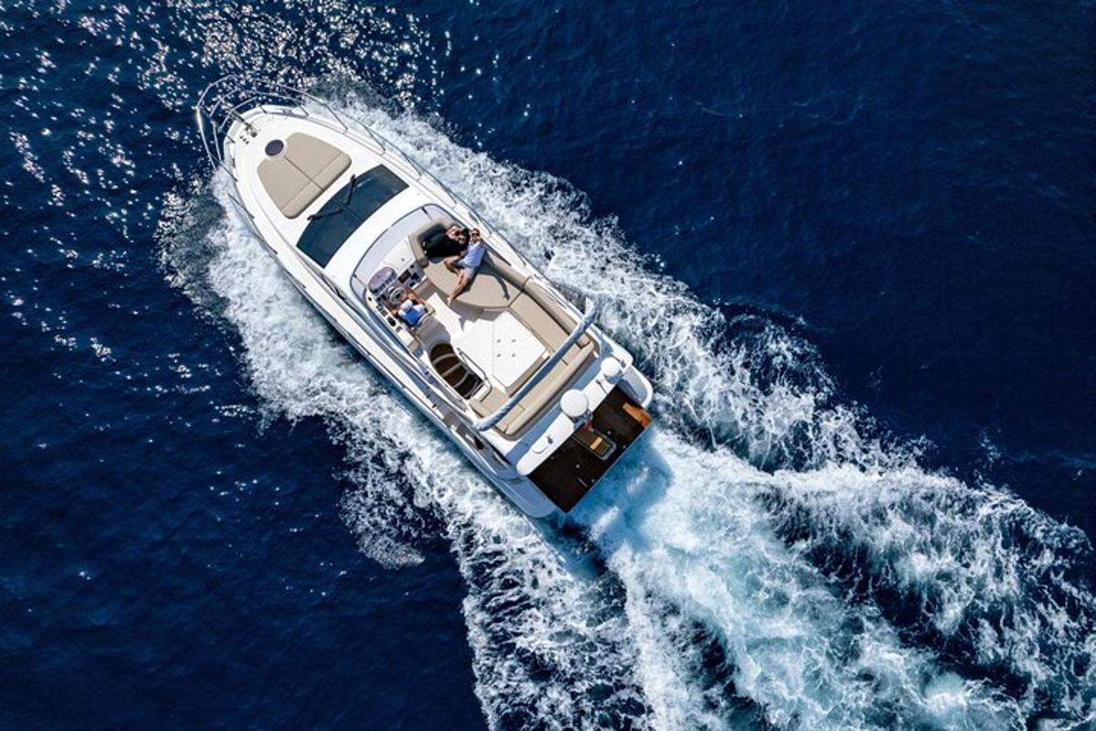a white boat in the water in the ocean