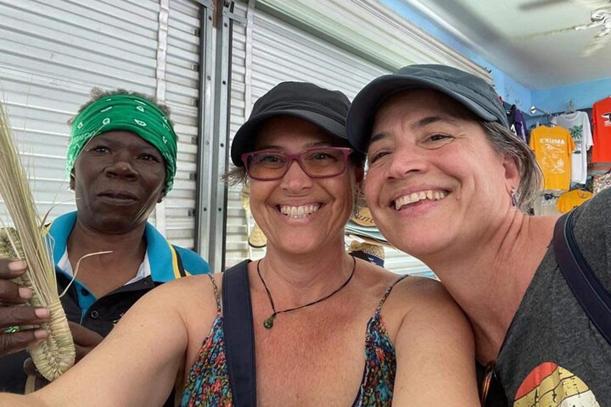 two men and a woman posing for a picture