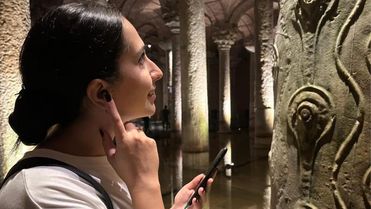a woman talking on a cell phone in a building