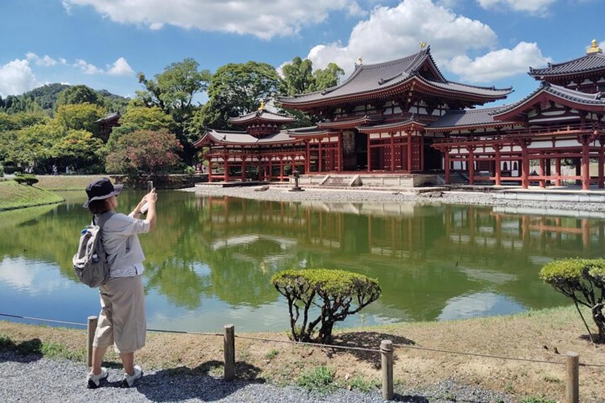 a woman taking a picture of a building