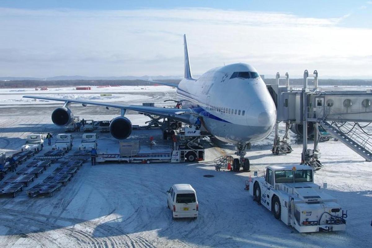 an airplane is parked on the tarmac at an airport