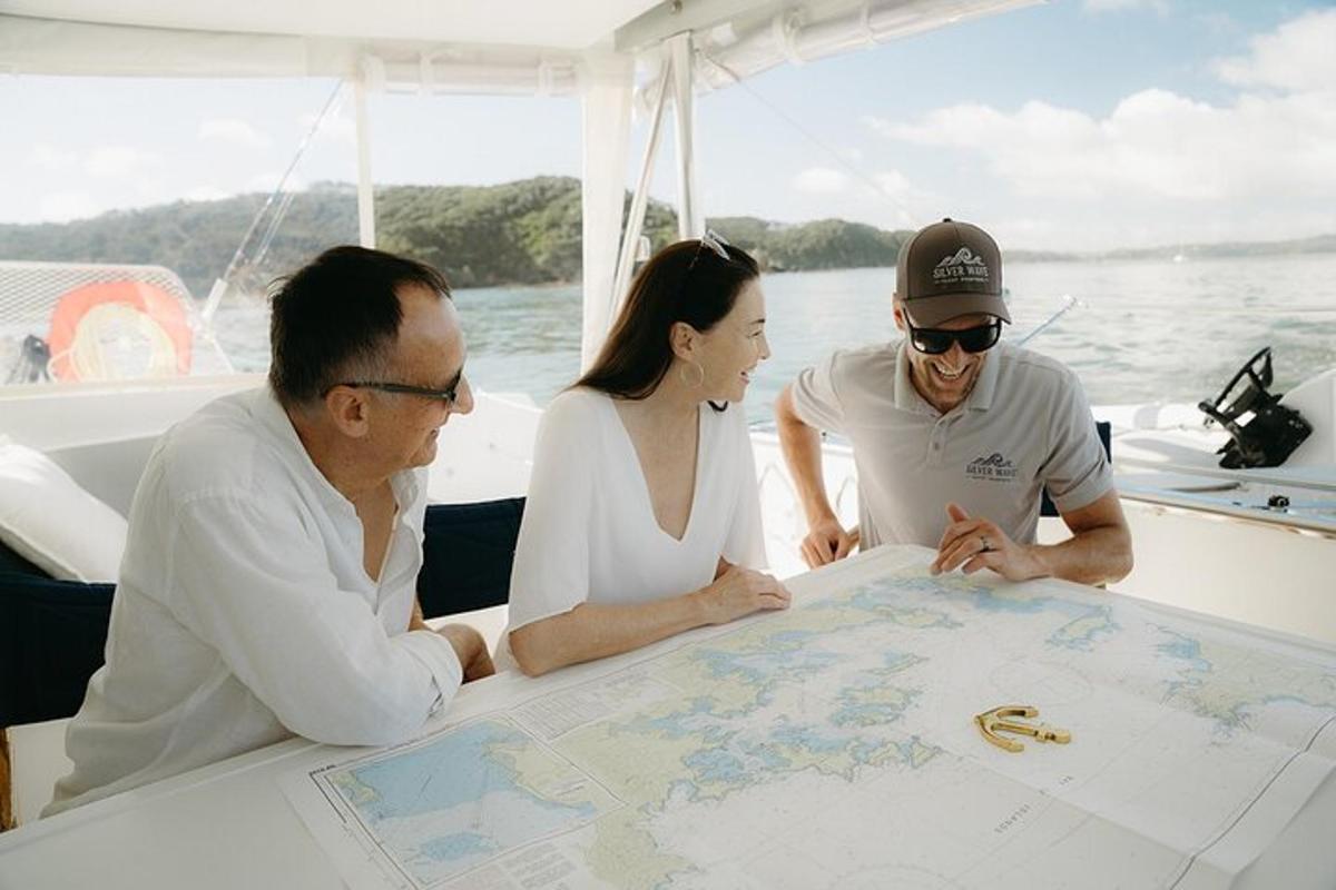 a group of people looking at a map on a boat