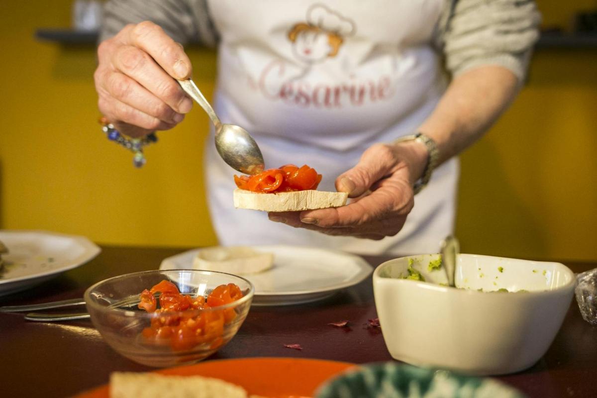 a person with a spoon and a bowl of food