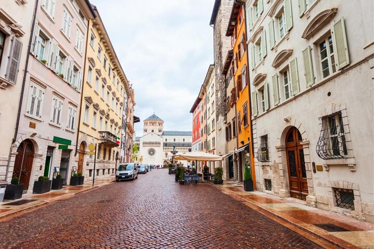 a cobblestone street in a city with buildings
