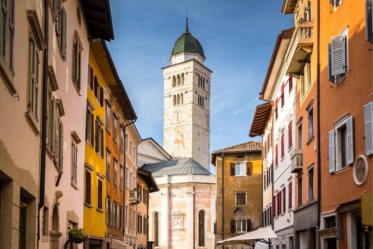 a building with a clock tower in the middle of a street