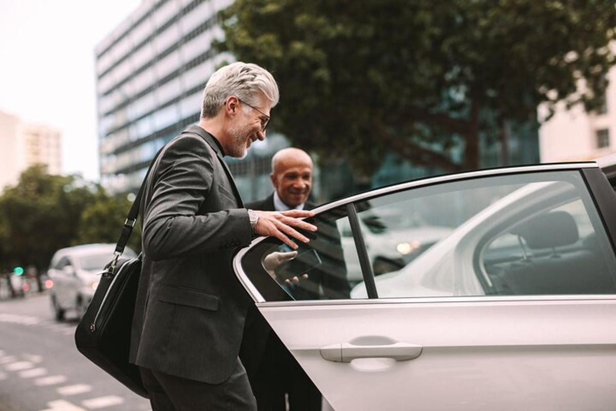 a man is getting out of a car
