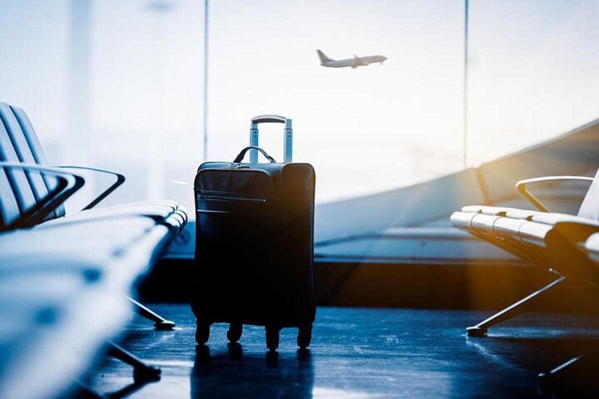a suitcase sitting on the floor in an airport