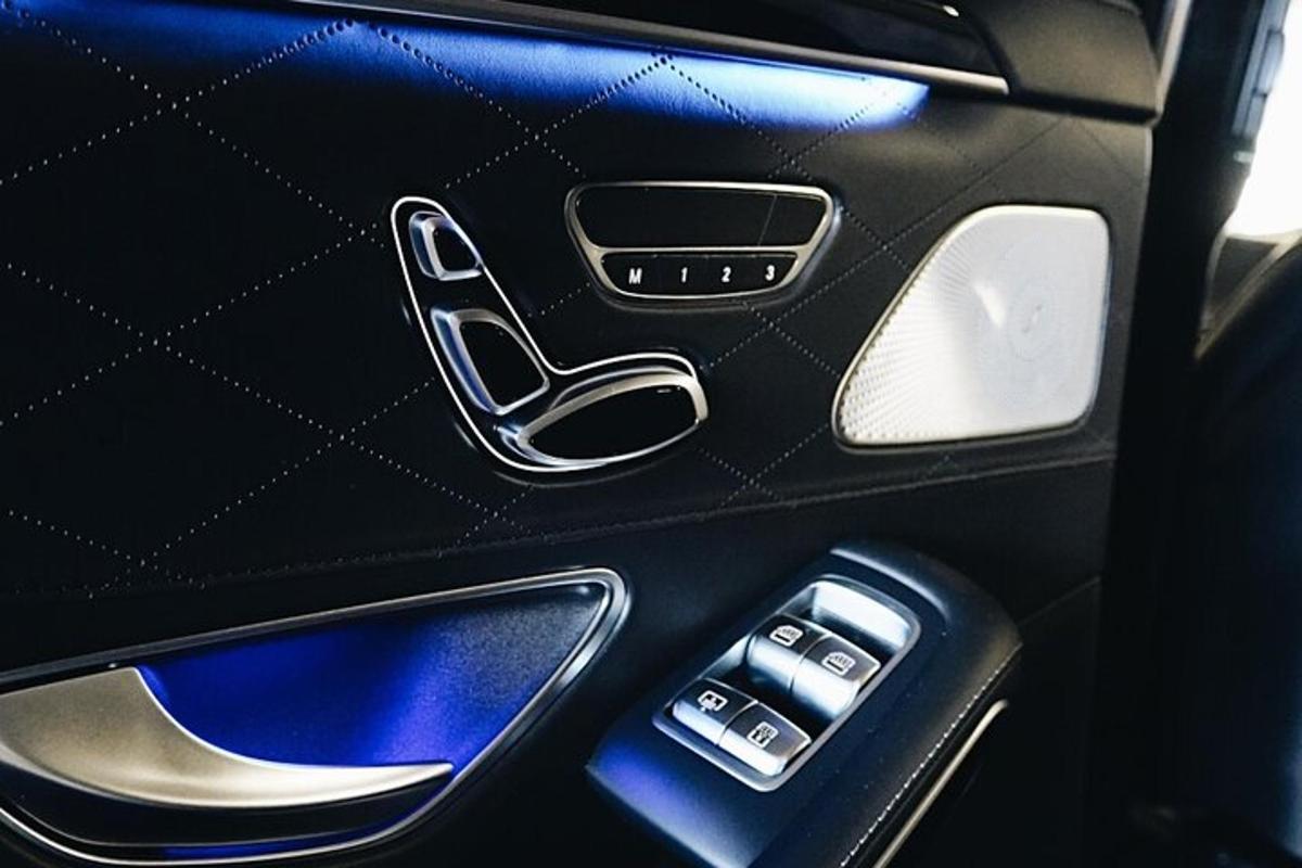 a close up of a car door with a remote control
