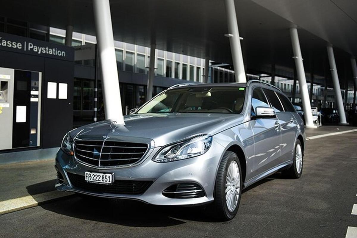 a silver car parked in front of a building