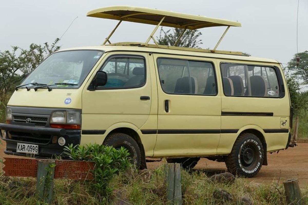 a yellow van with a surfboard on top of it
