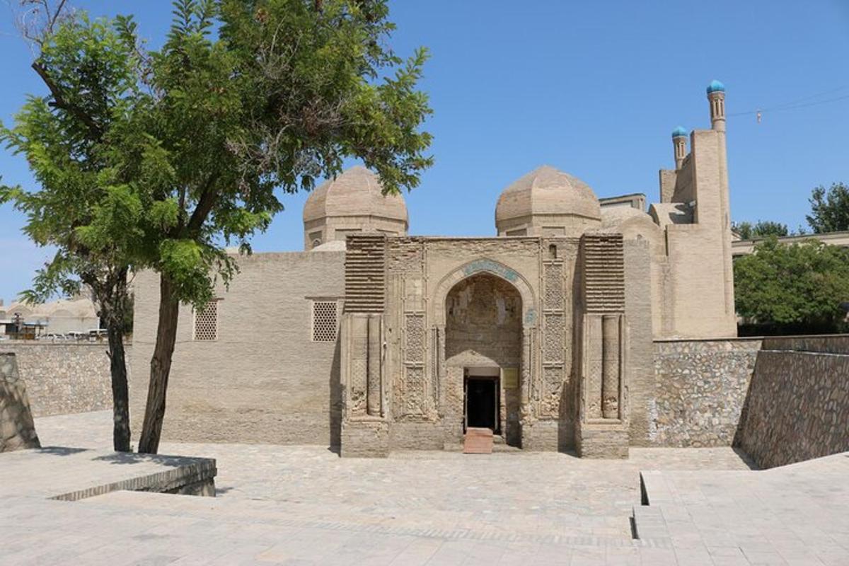 a large building with a tree in front of it