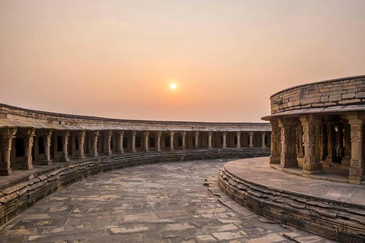 an empty amphitheater with the sunset in the background