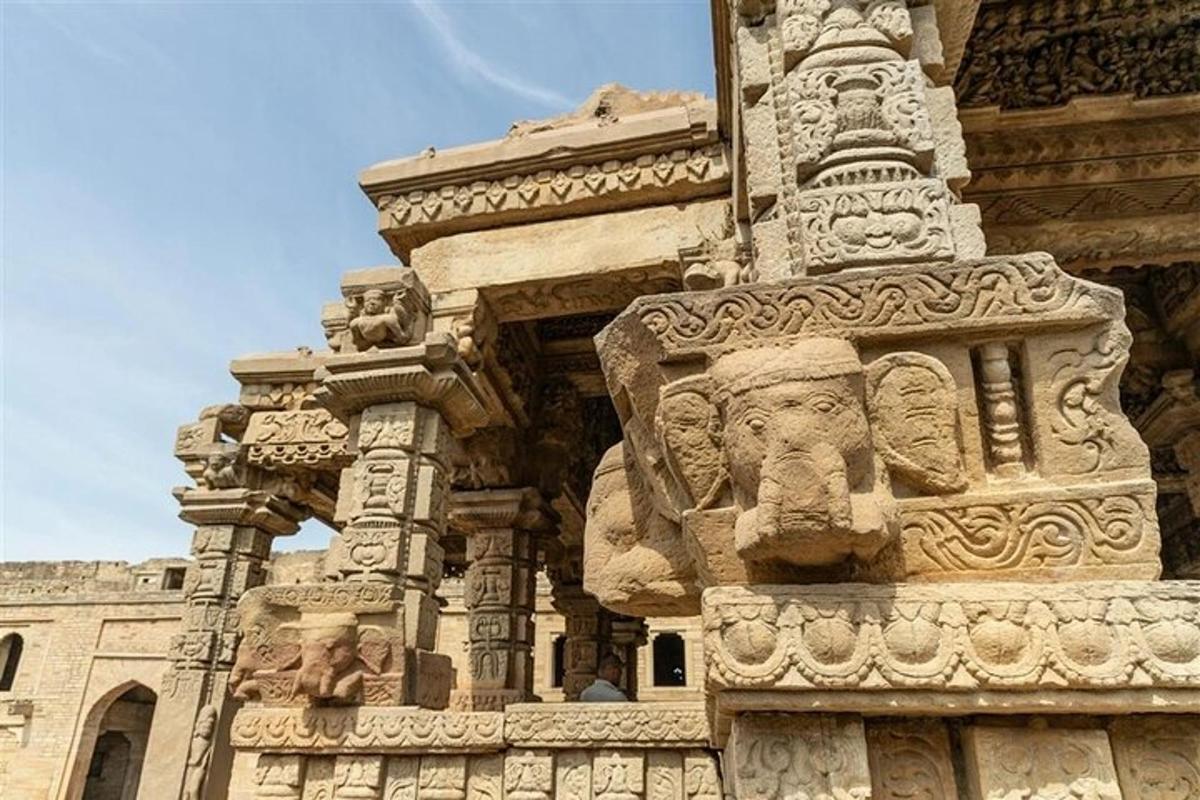 a building with statues on the side of it