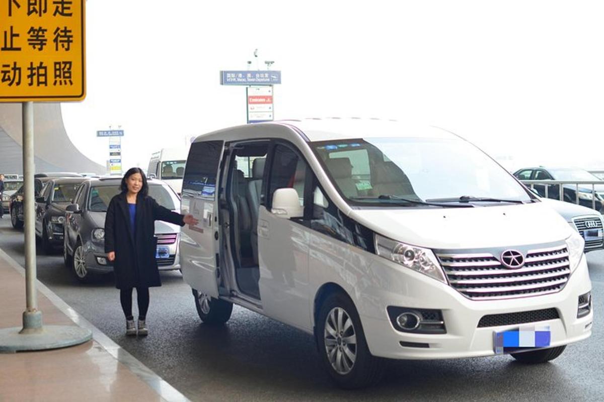 a woman is standing next to a white van