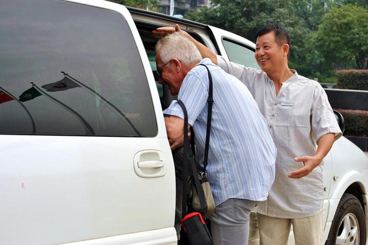 two men are getting into a white van