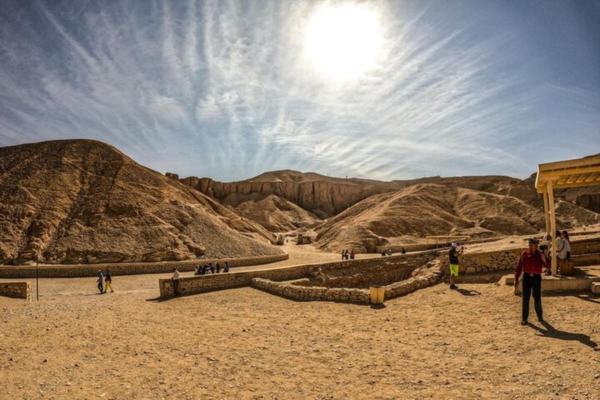 a group of people walking in the desert