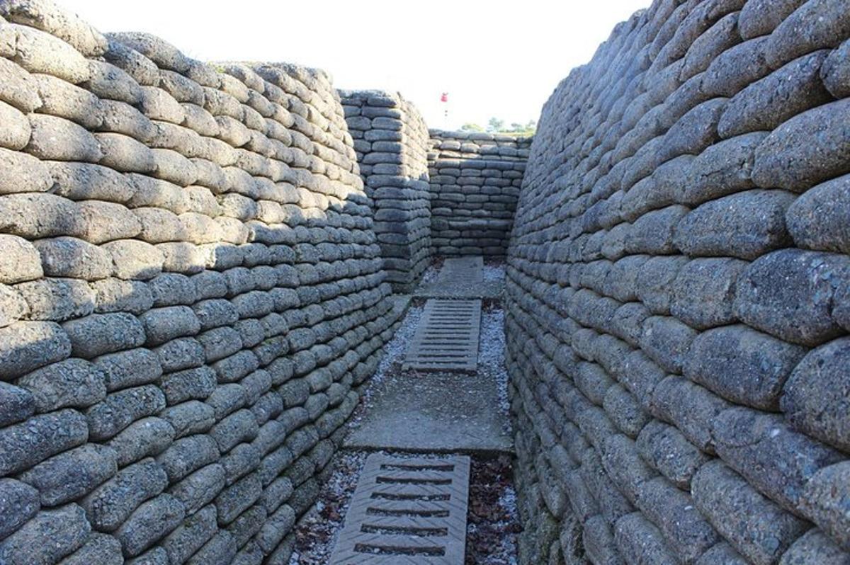 a large stone wall with twoadders in front of it