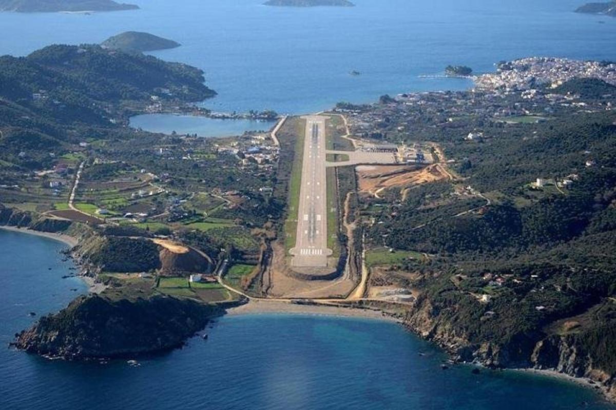 an aerial view of a bridge over a body of water