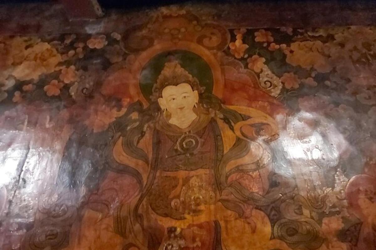 a painting of a woman on a ceiling