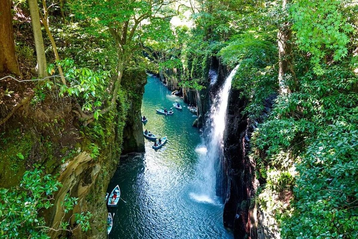 a group of people rafting down a waterfall