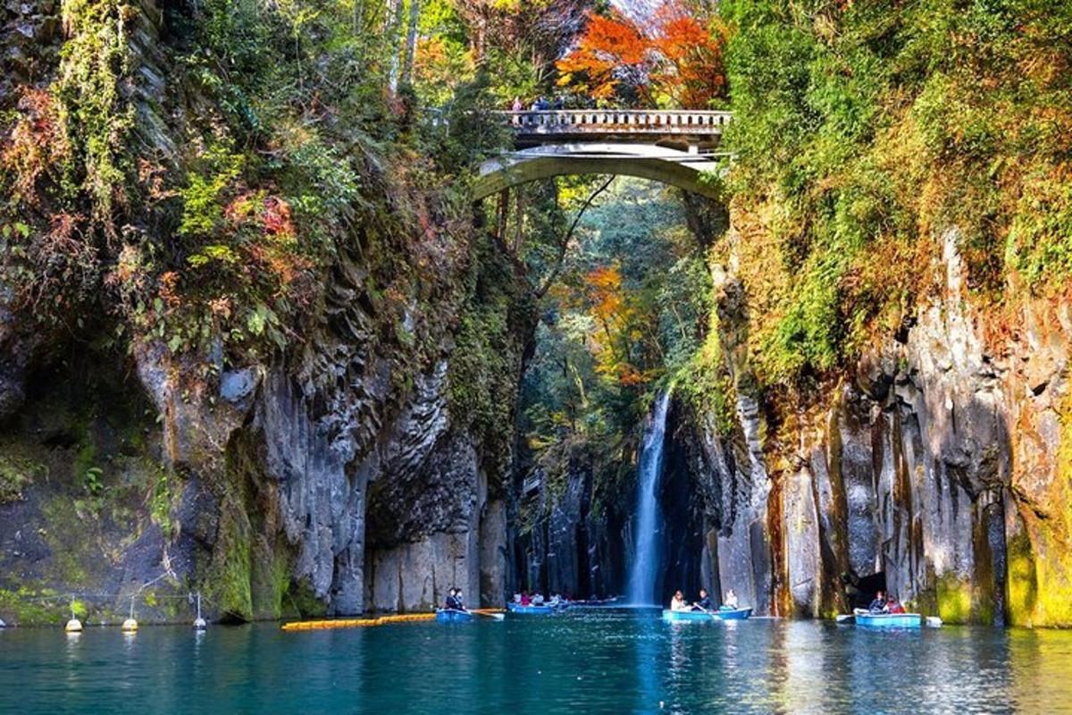 a bridge over a body of water with a waterfall