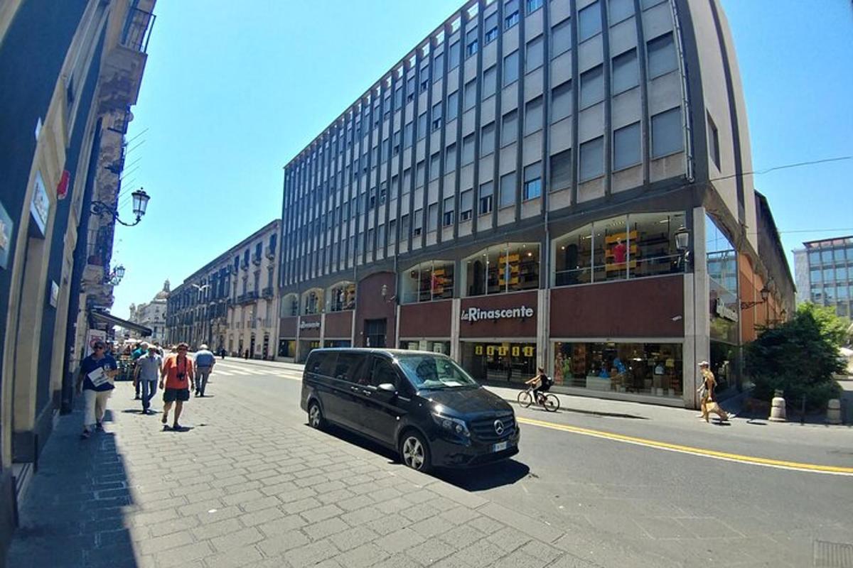 a car parked on a street in front of a building