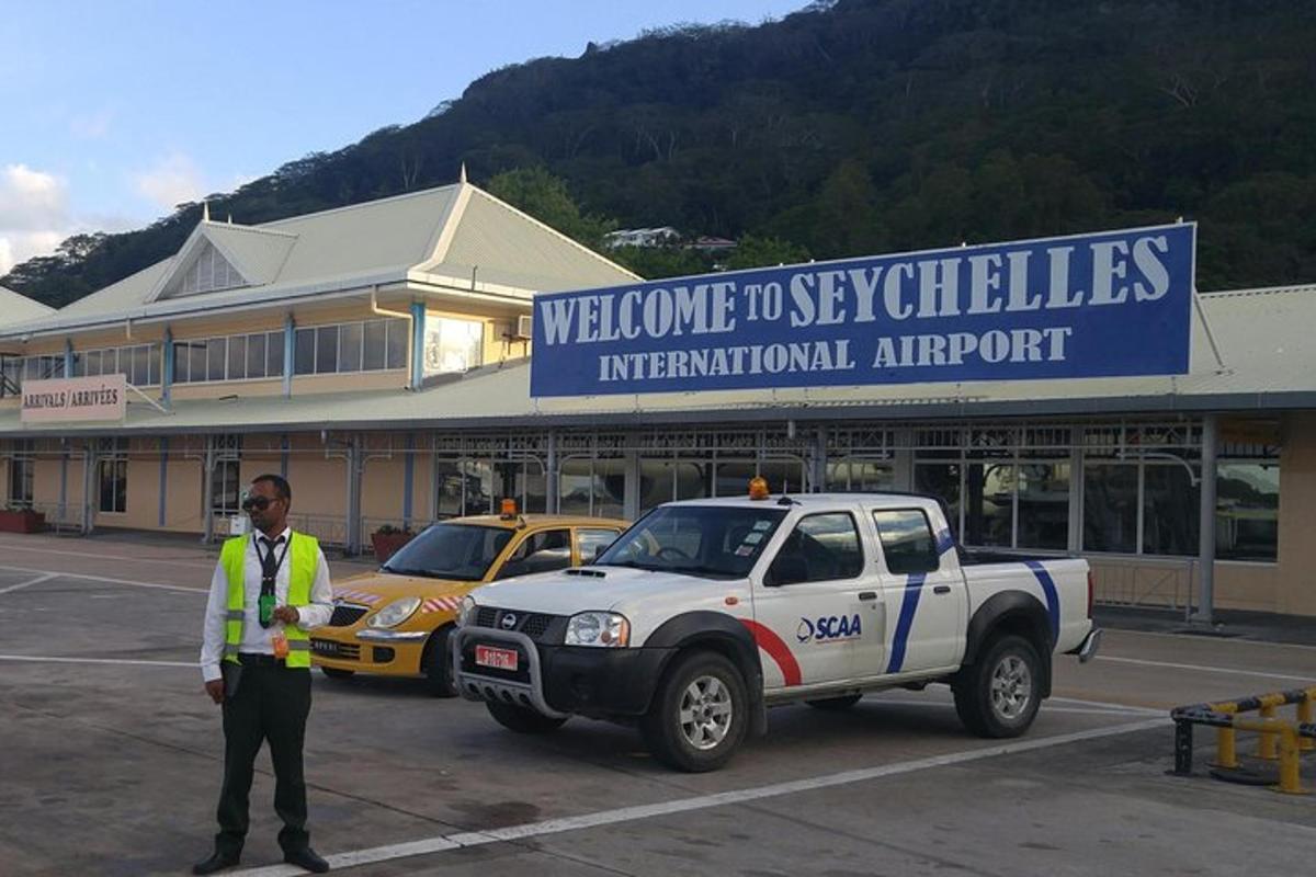 a police officer standing in a parking lot next to a truck