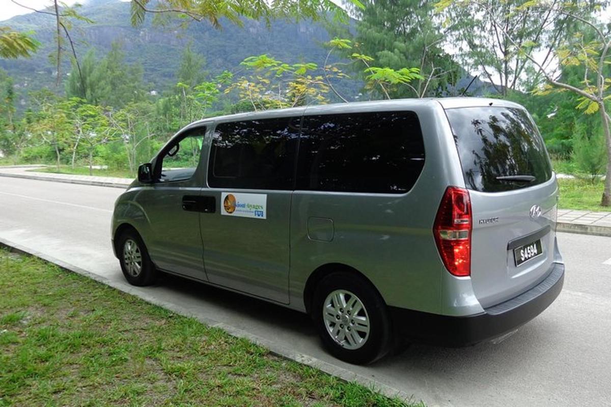 a green van parked on the side of a road