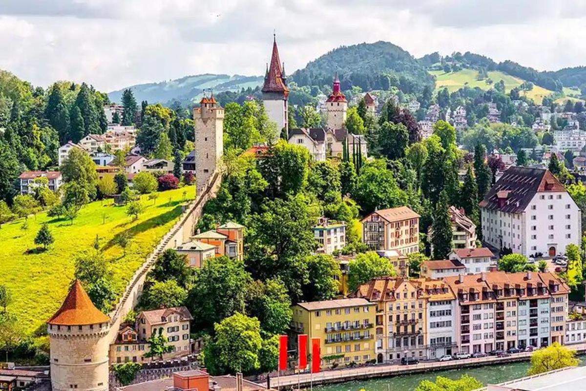 a city with towers and buildings on a hill