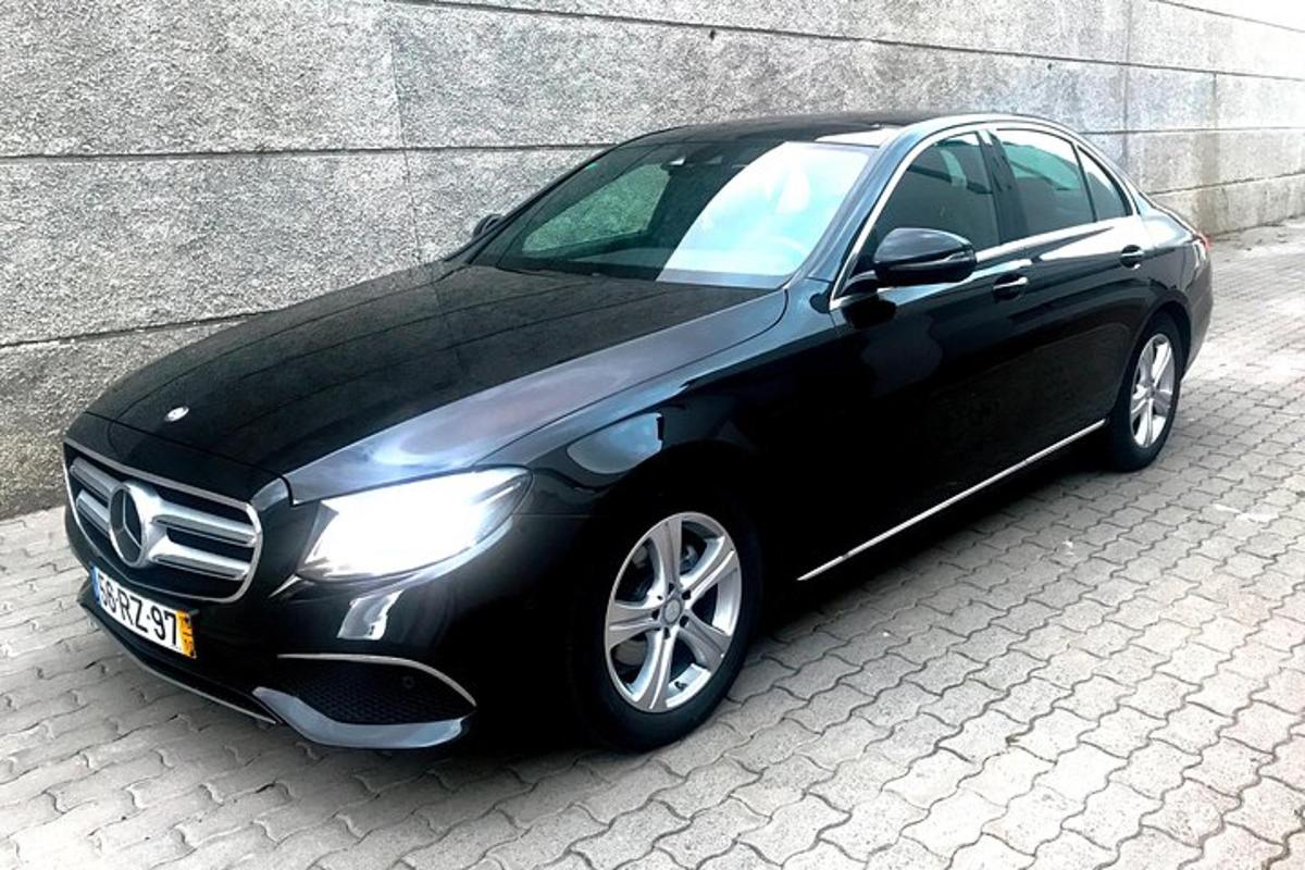 a black car parked in front of a building