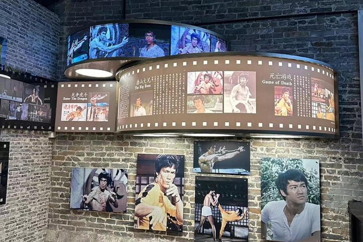 a brick wall with pictures offamous actors on it