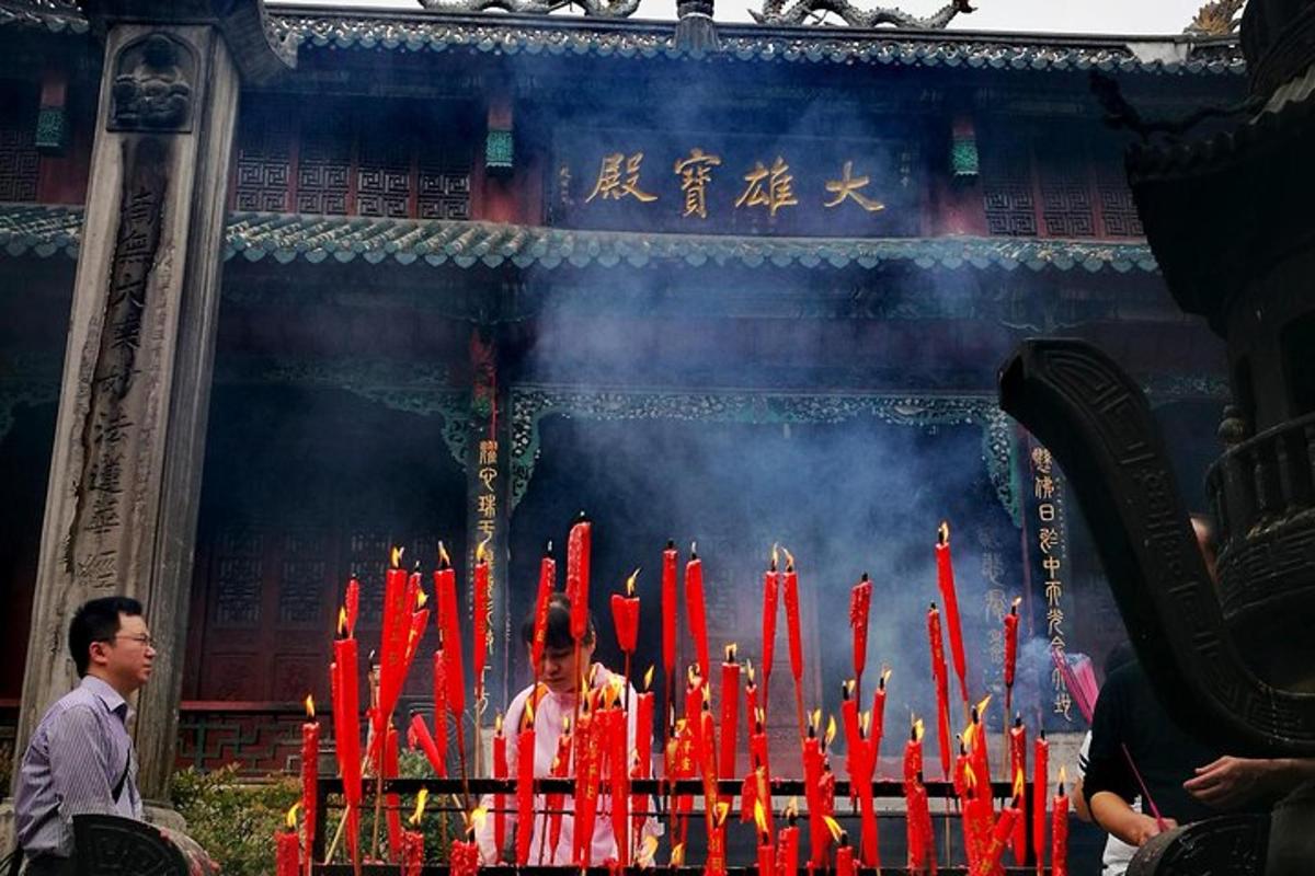 a group of red candles in front of a building