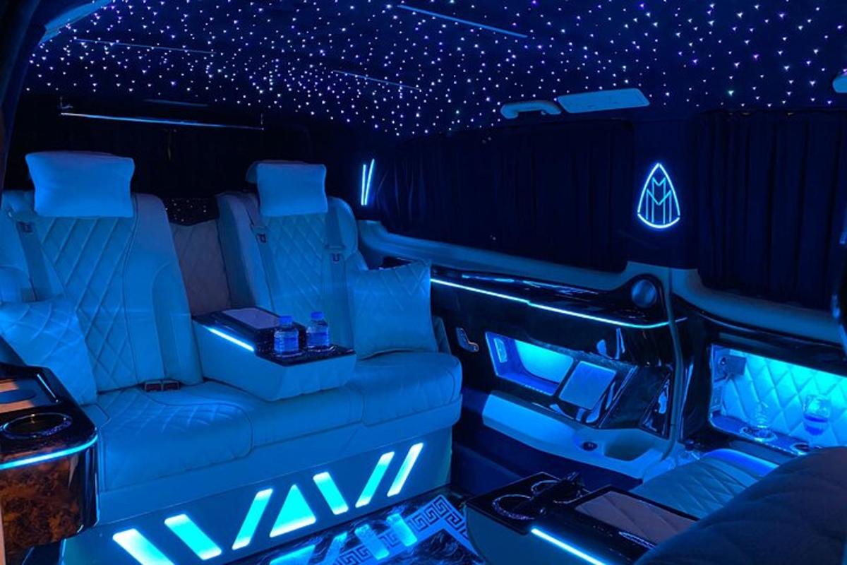 an inside view of a limousine with blue lights