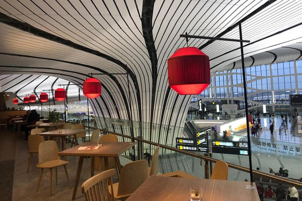 a restaurant with tables and chairs and red lights