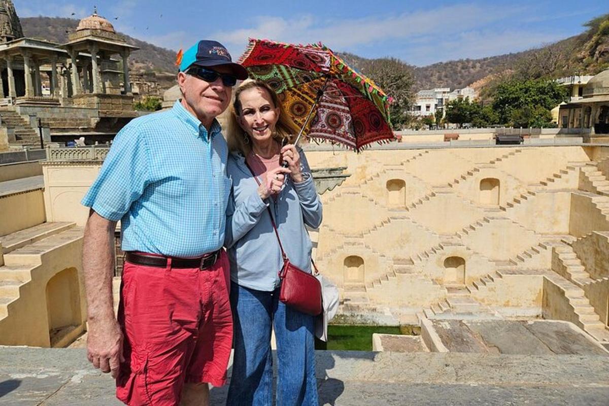 a man and a woman holding an umbrella
