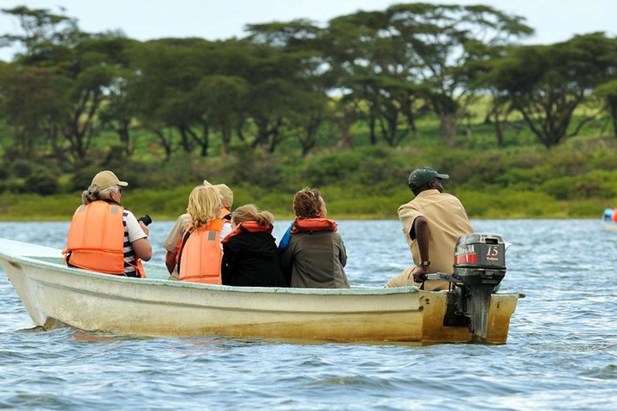 a group of people in a boat in the water