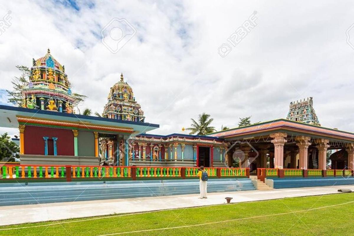 a view of a building with temples in the background