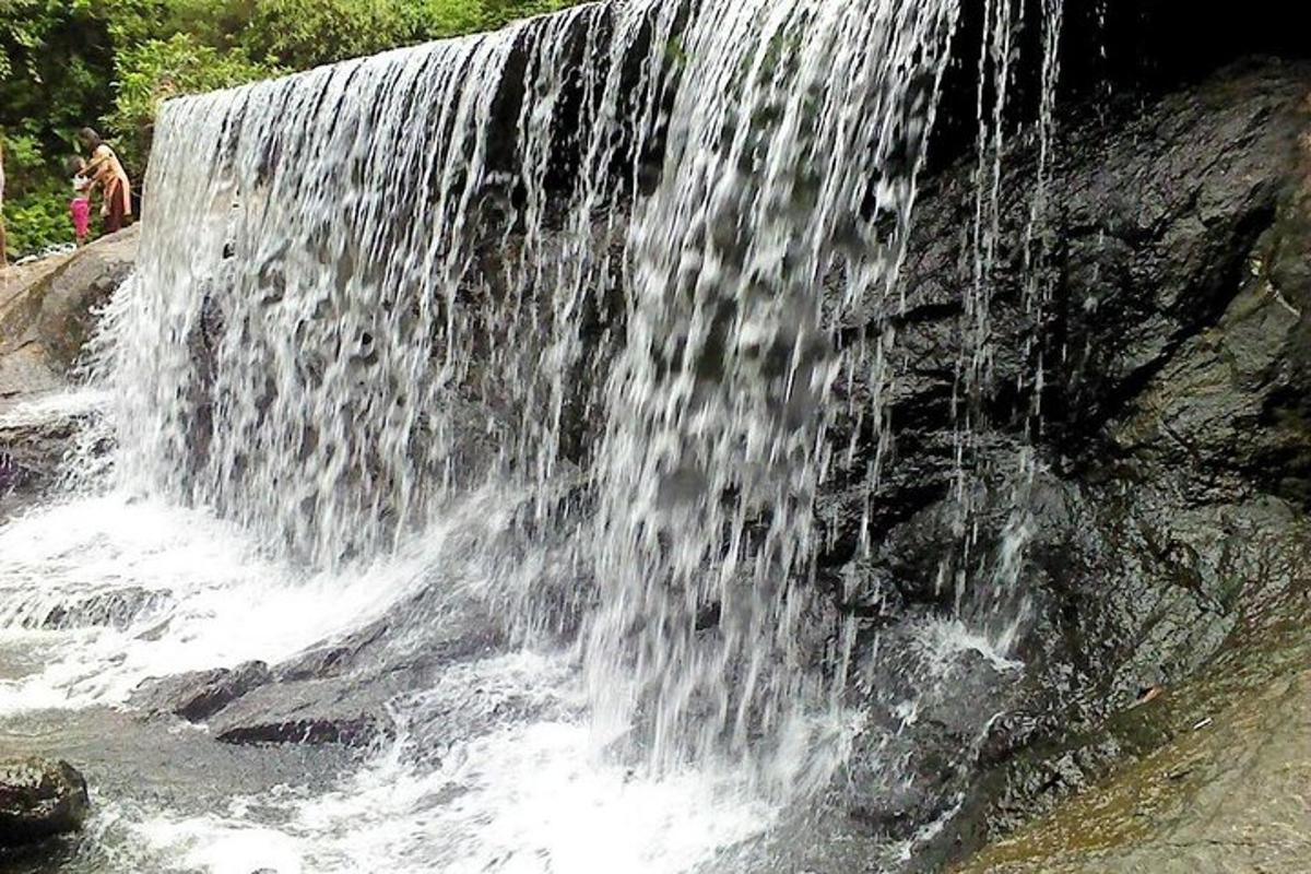 a waterfall on the side of a rock