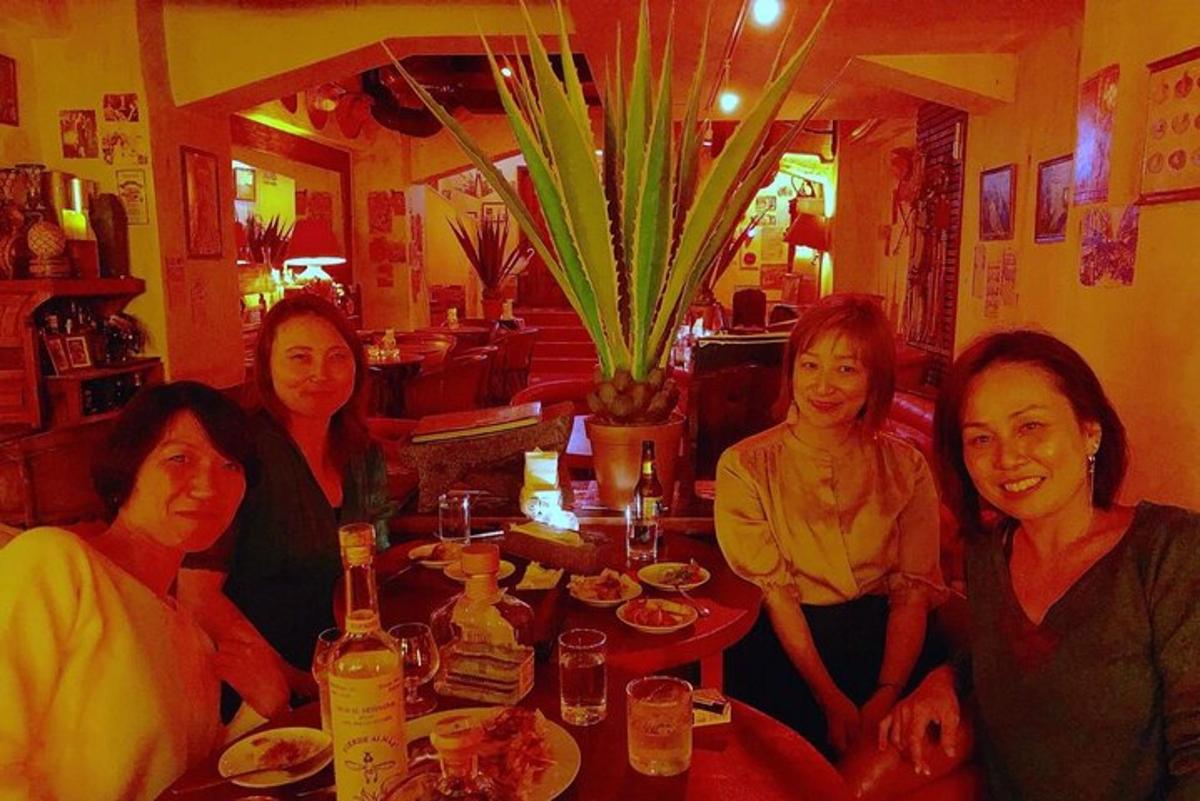 a group of women sitting at a table in a restaurant