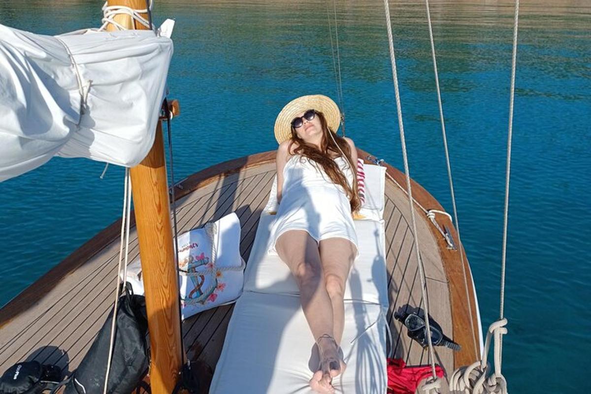 a woman sitting on the back of a boat