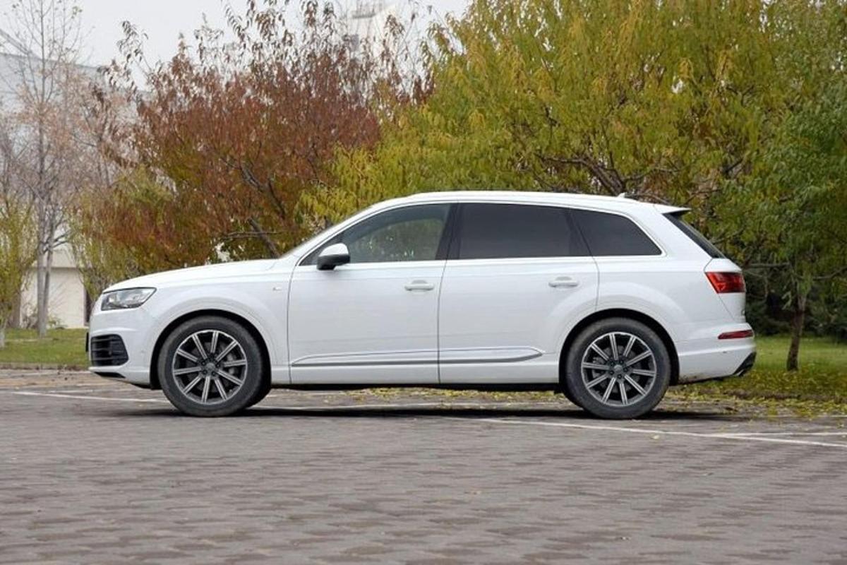 a white car parked in a parking lot