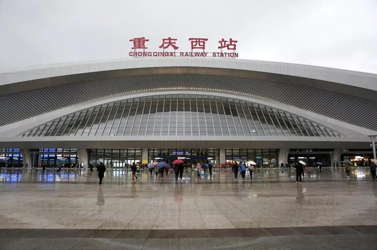 a large building with people walking in front of it