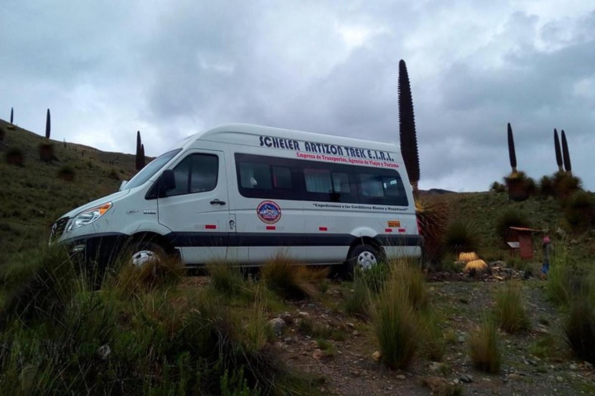 a white van parked in the middle of a field